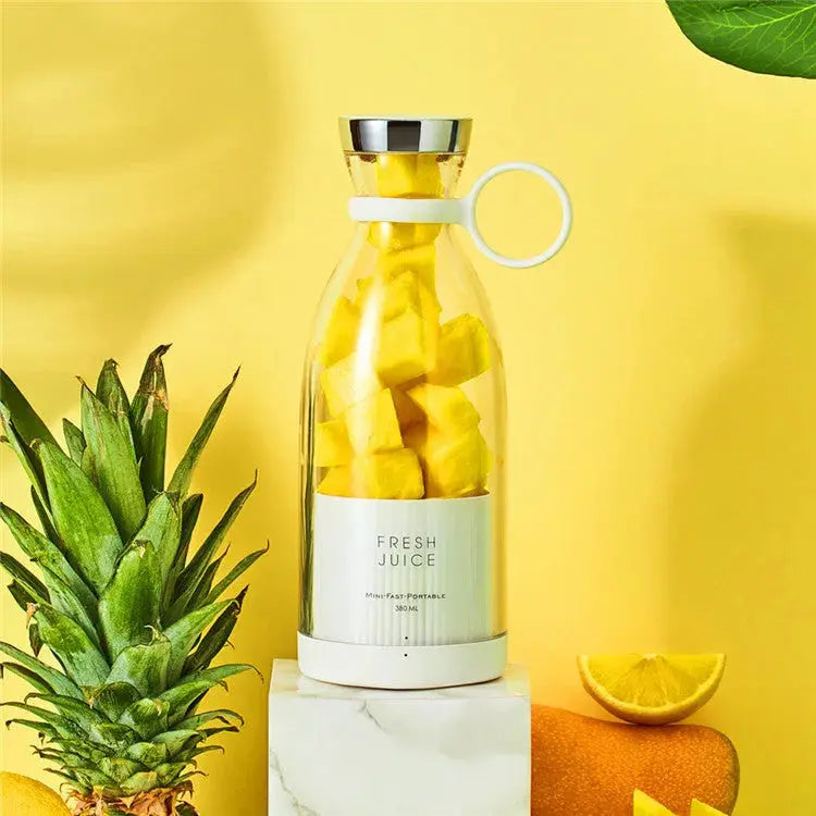 Bottle filled with pineapple pieces on a yellow background