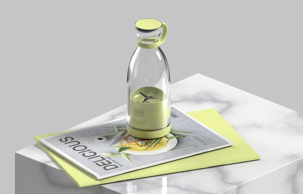 Clear glass bottle with green cap on a magazine with a light gray background