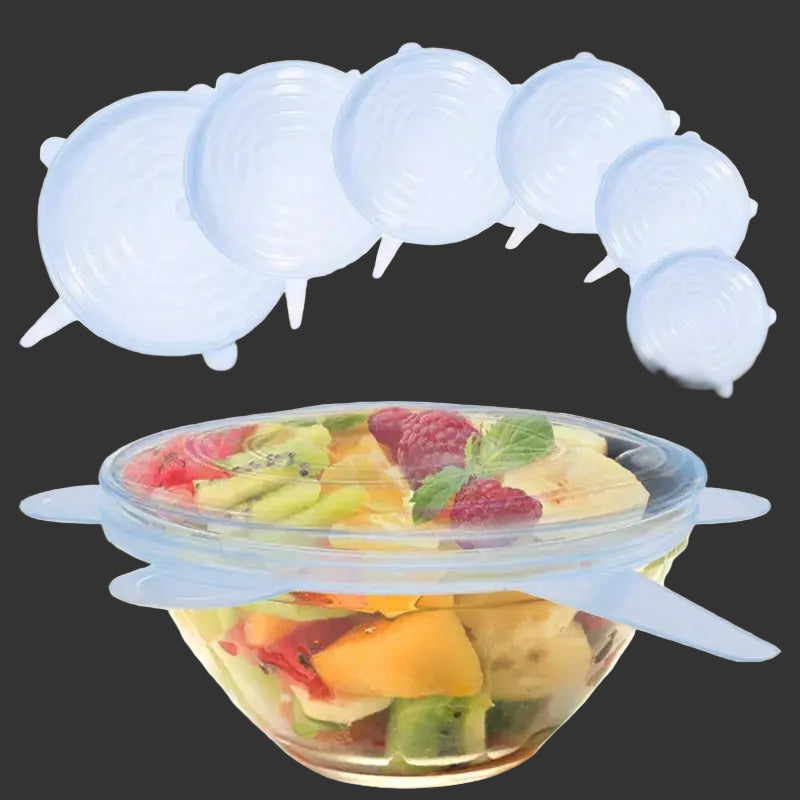 Silicone food covers on a bowl of fruit with a black background