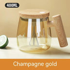 Glass teapot with wooden handle and lid on a white surface, featuring 'Champagne gold' text.