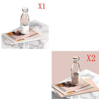 Two images of a clear bottle with a pink cap on a marble surface with a magazine.