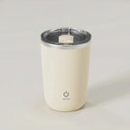 White tumbler with a silver lid on a light gray background