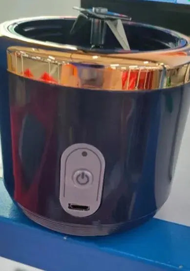 Blue and gold container with a power button on a blue surface