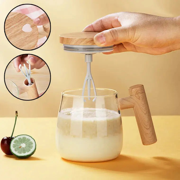 Hand using a handheld milk frother to create foam in a glass of milk on a yellow background.